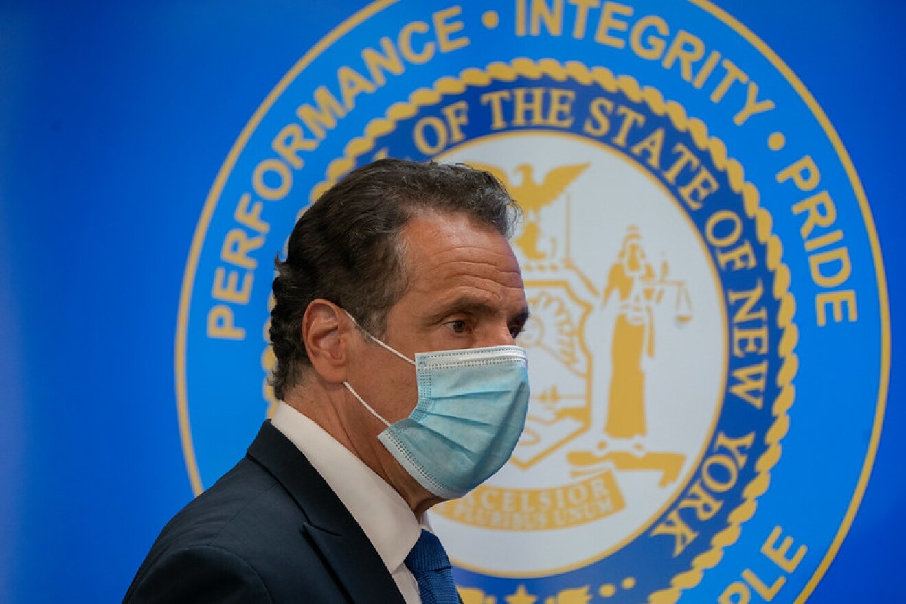 Gov. Andrew Cuomo enters his daily coronavirus briefing in New Rochelle on Friday.